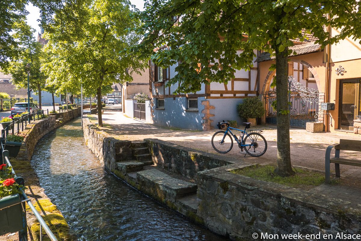 Bicycle parked on the cobblestone streets of the village of Scherwiller