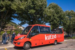 Red Kut'zig open-top bus on the Alsace Wine Route